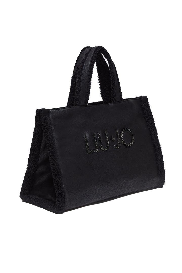 LIU JO Shopping bag nera in tessuto spalmato e dettagli in teddy - Mancinelli 1954