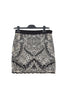 Slim black mini skirt in stretch cotton with white floral embroidery