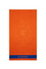 Solid color cotton beach towel with orange rooster logo