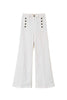 White flare jeans with decorative buttons