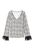 Black and white sweater printed with feathers